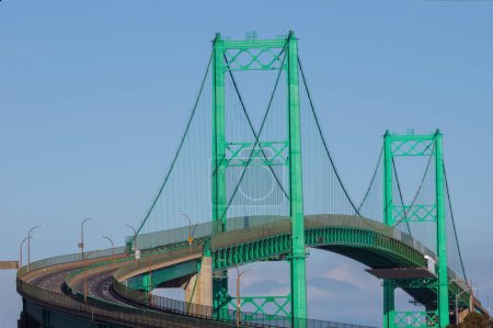 The Vincent Thomas Bridge in San Pedro, California shown in the afternoon on a sunny day.