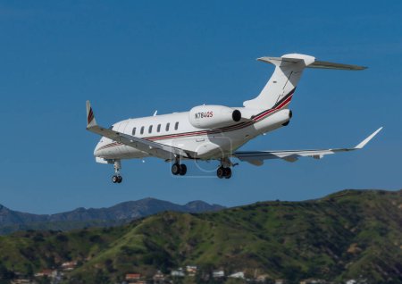Photo for Burbank, California, United States - April 4, 2023: Bombardier Challenger 300 with registration N784QS shown moments before landing at Hollywood Burbank Airport. - Royalty Free Image