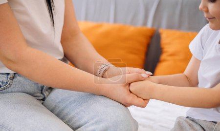 Photo for I know you can. Close-up of a mother and son holding hands tightly. mother helps her son overcome life problems. - Royalty Free Image
