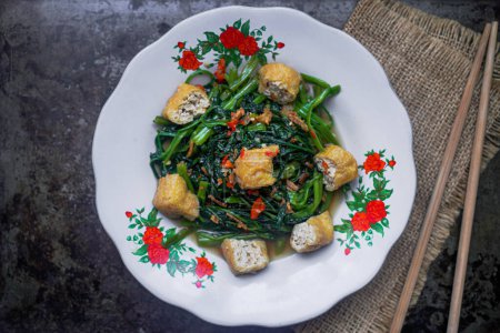 Photo for Tumis kangkung is Stir Fried Water Spinach cooked with spices - Royalty Free Image