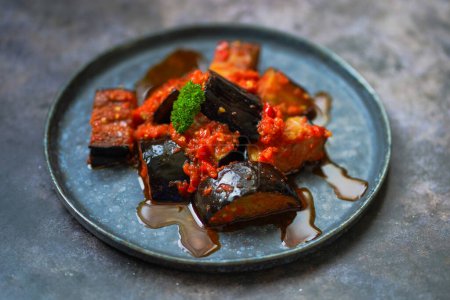 Terong Balado is Indonesian food made of deep-fried eggplants cooked with spicy chili sambal