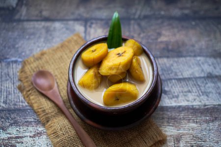Photo for Kolak Pisang: Indonesian dessert made from banana and cooked in coconut milk and palm sugar - Royalty Free Image