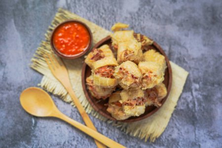 Photo for Tahu isi is Indonesian Deep Fried Stuffed Tofu served with chili sambal paste - Royalty Free Image