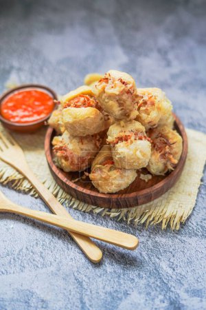 Photo for Tahu isi is Indonesian Deep Fried Stuffed Tofu served with chili sambal paste - Royalty Free Image