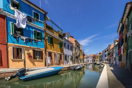 Photo for Venice - 25 May 2017 - Island of Burano with Colourful Houses and Lagoon under Blue Skies and Summer Sun in Venice, Italy 01 - Royalty Free Image