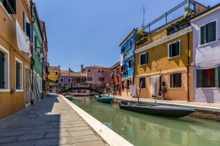 Photo for Venice - 25 May 2017 - Island of Burano with Colourful Houses and Lagoon under Blue Skies and Summer Sun in Venice, Italy 05 - Royalty Free Image