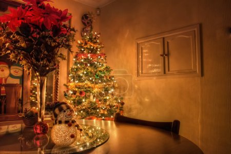 Photo for Festive Scene of Dining Table with Christmas Tree and Decorations - Royalty Free Image