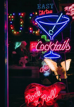 Cocktails Coloured Neon Lights on Shop Window at Night in London, UK