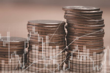 Coins stacked on brown background. Investment finance concept. Copy space.
