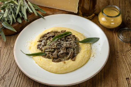 Photo for Delicious fried liver with polenta and Parmesan cheese - Royalty Free Image