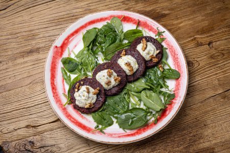 Selection of healthy vegetarian dishes with spinach, feta cheese, pumpkin and beetroot