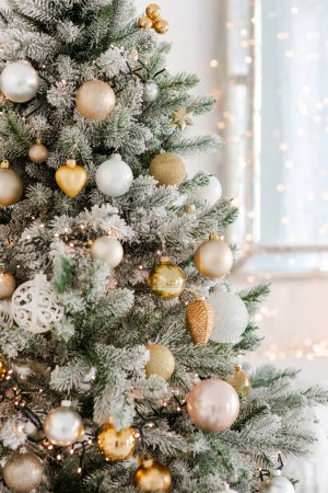 Photo for Christmas decoration on an abstract background. Festively decorated Christmas tree. Happy New Year. Soft selective focus, copy space. - Royalty Free Image