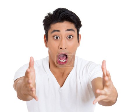 portrait of a wild, goofy, crazy, funny, shocked surprised stunned young man with wide open mouth and eyes, isolated on white background.
