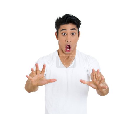 Photo for Shocked scared young man giving a stop hand gesture - Royalty Free Image