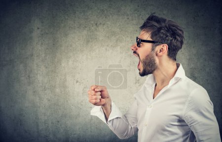 Photo for Portrait of a young angry man screaming - Royalty Free Image