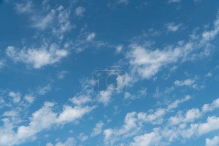 Photo for Lovely blue sky with a few scattered white clouds. cloudscape and sky background concept. - Royalty Free Image
