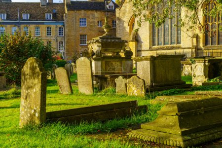 Photo for Cirencester, UK - October 17, 2022: View of the Church of St. John the Baptist, and its yard cemetery, in Cirencester, the Cotswolds region, England, UK - Royalty Free Image