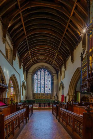 Photo for Cirencester, UK - October 17, 2022: View of the interior of the Church of St. John the Baptist, and its stained-glass windows, in Cirencester, the Cotswolds region, England, UK - Royalty Free Image