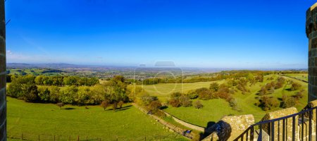 Photo for Broadway, UK - October 18, 2022: Panoramic view of countryside landscape, viewed from the Broadway Tower, with visitors, in the Cotswolds region, England, UK - Royalty Free Image