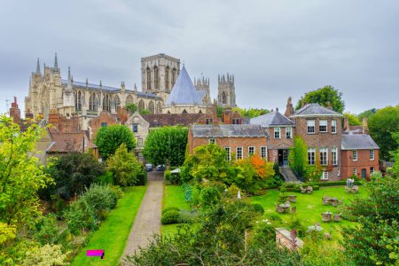 Photo for York, UK - September 22, 2022: View of old brick buildings, and the York Minster (Cathedral and Metropolitical Church of Saint Peter), in York, North Yorkshire, England, UK - Royalty Free Image