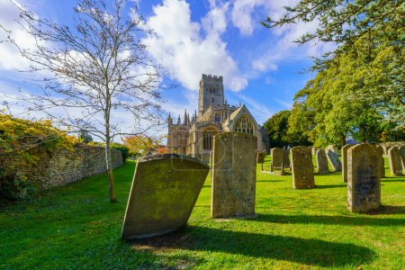 Photo for View of the Northleach Church of St Peter and St Paul, and its cemetery, the Cotswolds region, England, UK - Royalty Free Image