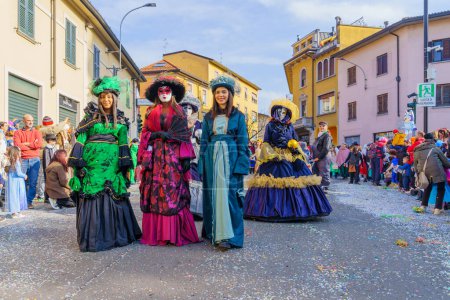 Photo for Cantu, Italy - February 25, 2023: Carnival parade, with displays and participants in costumes, in Cantu, Lombardy, Northern Italy - Royalty Free Image