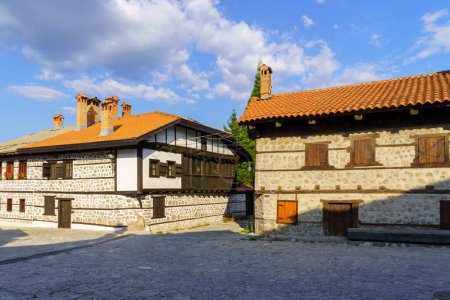 Bansko, Bulgaria - September 30, 2023: Street scene with typical buildings, locals, and visitors, in Bansko, southwestern Bulgaria