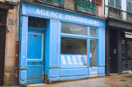 Photo for 20-10-2012 Bayonne, France - Explore the charm of an old, blue facade real estate agency in picturesque Bayonne - Royalty Free Image