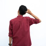 asian man, business or student concept wearing red casual shirt thinking pose, looking for ideas, getting ideas, confused. Isolated white background.