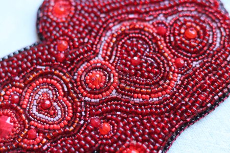 Photo for Close up photo of handmade jewelry made of red glass beads. - Royalty Free Image