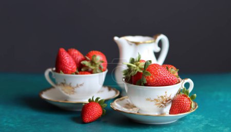 Strawberries in a white bowl on a light background, top view