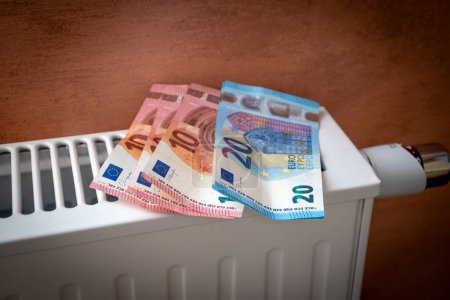 Photo for Banknotes placed on a radiator - Royalty Free Image