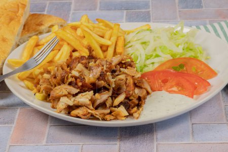 Foto de Plate of kebab and fries close up - Imagen libre de derechos