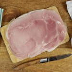 slices of ham, close-up, on a table