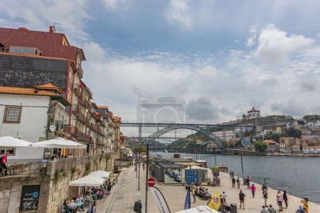 Photo for Porto, North Region, Portugal - 05302023 : view of the river Douro, the Dom Luis Bridge, the old city of Porto and the cais de ribeira - Royalty Free Image