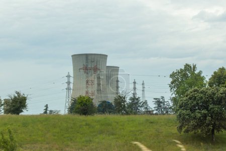 Photo for Saint-Paul-Trois-Chteaux, Drme, France - 05212023: view of the cooling towers at the Tricastin nuclear power plant - Royalty Free Image