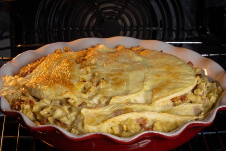 dish of croziflette, close-up, in an oven