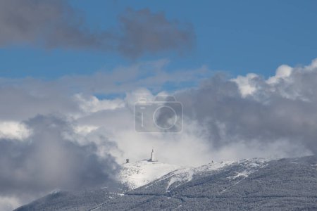 view of Mont Ventoux, in winter, with a blue sky.