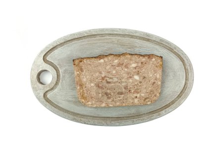 slice of country terrine on a cutting board, isolated on a white background.