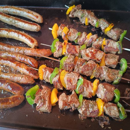 close-up of a barbecue. Beef and sausage skewers.