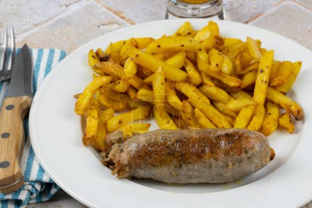 andouillette and fries, close-up, on a plate