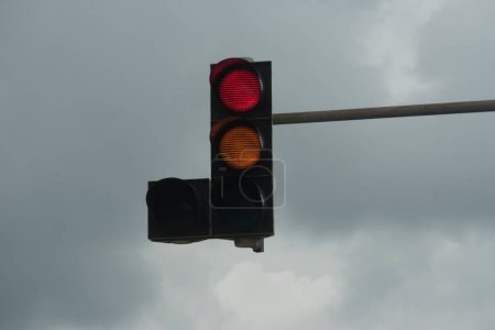 red traffic light signal on the street, symbol for stopping