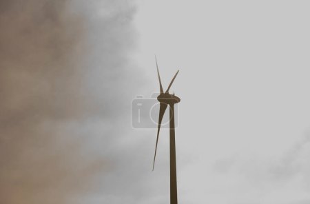 Photo for Wind wheel or wind turbine for generating electrical energy and power - Royalty Free Image