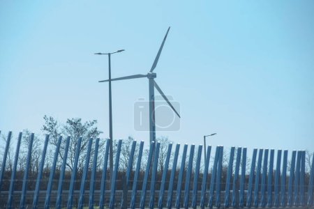 Photo for Wind wheel or wind turbine for generating electrical energy and power - Royalty Free Image