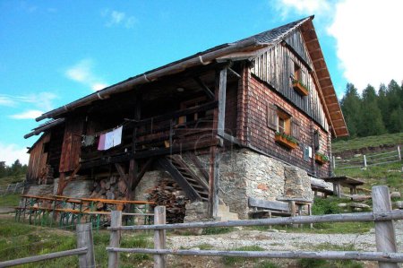 alpine hut and alpine farming on a mountain pasture, agriculture in the alps