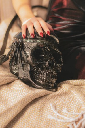Women's handbag in the shape of a skull. Unusual women's handbag in Gothic style