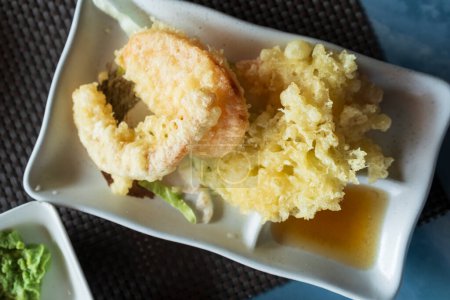 Top view of prepared Japanese vegetable tempura recipe with ginger ponzu sauce.