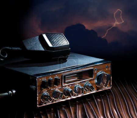 Emergency radio with a storm that is coming from behind