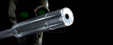 Photo for Skull with green eyes behind a silencer on black - Royalty Free Image