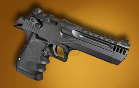Téléchargez les photos : Semi auto handgun on an orange background with a dropshadow - en image libre de droit